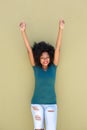 Cheerful black woman smiling with outstretched arms