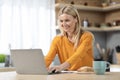 Cheerful blonde woman entrepreneur working from home Royalty Free Stock Photo