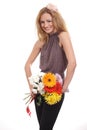 Cheerful blonde woman with a flower bouquet