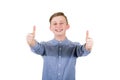 Cheerful boy adolescent showing double thumbs up, positive gesture, great feedback and approval, looking to camera with tooth Royalty Free Stock Photo