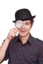 Cheerful boy in black hat with loupe Royalty Free Stock Photo