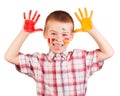 Cheerful boy with paint on his face and palms isolated. Royalty Free Stock Photo