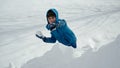 Cheerful boy plays snowball fight having fun Royalty Free Stock Photo