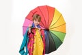 Cheerful boy in raincoat with colorful umbrella. Handsome little guy in preparing for Autumn. Cloud rain umbrella