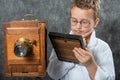 Cheerful boy retro photographer with vintage wooden camera Royalty Free Stock Photo