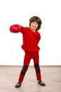 Cheerful boy showing his fist in boxing gloves Royalty Free Stock Photo