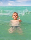 Cheerful boy swimming in the sea Royalty Free Stock Photo