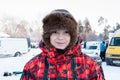 Cheerful boy in winter clothes