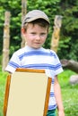 Cheerful boy with a wooden shield and sword Royalty Free Stock Photo