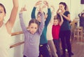 Cheerful boys and girls rehearsing ballet dance in studio Royalty Free Stock Photo