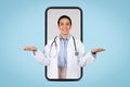 Cheerful brazilian doctor woman holding something invisible on her hands posing on huge smartphone screen, collage Royalty Free Stock Photo