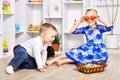 Cheerful brother and sister playing in the Easter