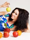 Cheerful brunette with fresh fruits
