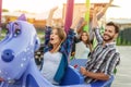 Cheerful buddies relaxing on playground