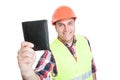 Cheerful builder showing black leather wallet