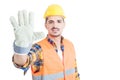 Cheerful builder showing number five or doing high five gesture