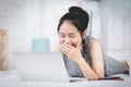 Cheerful business lady working on laptop comouter at home . Royalty Free Stock Photo