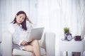 Cheerful business lady working on laptop comouter at home . Royalty Free Stock Photo