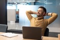 Cheerful Business Man Relaxing Sitting Near Laptop In Modern Office Royalty Free Stock Photo