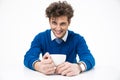 Cheerful business man sitting at the table