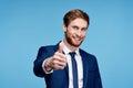 cheerful business man in a suit gesturing with his hands emotions studio Royalty Free Stock Photo