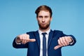 cheerful business man in a suit gesturing with his hands emotions studio Royalty Free Stock Photo