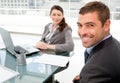 Cheerful business people working on a laptop Royalty Free Stock Photo