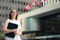 Cheerful business woman walking downtown in a Canadian city Royalty Free Stock Photo