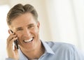 Cheerful Businessman Answering Smart Phone Royalty Free Stock Photo