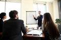 Cheerful businessman discussing new business project with the members of his team Royalty Free Stock Photo