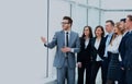 Cheerful businessman discussing a new business project with the members of his team. Royalty Free Stock Photo