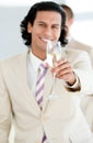 Cheerful businessman holding a glass of Champagne Royalty Free Stock Photo