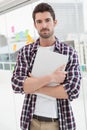 Cheerful businessman holding his laptop Royalty Free Stock Photo