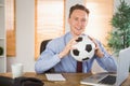 Cheerful businessman holding a soccer ball Royalty Free Stock Photo