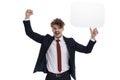 Cheerful businessman holding speech bubble and celebrating, laughing Royalty Free Stock Photo