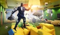 Cheerful businessman jumping high. Mixed media Royalty Free Stock Photo