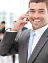 Cheerful businessman on the phone during a meeting Royalty Free Stock Photo