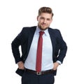 Cheerful businessman pulling his pants and smiling Royalty Free Stock Photo