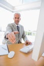 Cheerful businessman reaching hand out for handshake Royalty Free Stock Photo