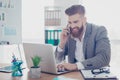 Cheerful businessman is smiling talking to businesspartner about Royalty Free Stock Photo