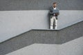 Cheerful businessman typing on laptop outdoors Royalty Free Stock Photo