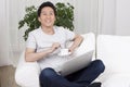 Cheerful businessman using a laptop in sofa Royalty Free Stock Photo