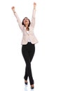 Cheerful businesswoman celebrating and screaming while walking