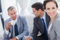 Cheerful businesswoman having a meeting with her colleagues Royalty Free Stock Photo