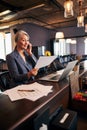 Cheerful businesswoman having phone conversation at work Royalty Free Stock Photo