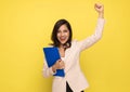 Cheerful businesswoman holding clipboard and celebrating victory Royalty Free Stock Photo