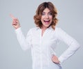 Cheerful businesswoman pointing finger away Royalty Free Stock Photo