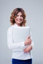 Cheerful businesswoman standing with laptop Royalty Free Stock Photo