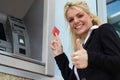 Cheerful businesswoman thumbs up, toothy smile