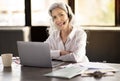 Cheerful Businesswoman Wearing Headset Communicating Online At Laptop In Office Royalty Free Stock Photo